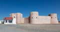 Fort in Barka, Oman, with Ladies Tailoring shop next to it Royalty Free Stock Photo