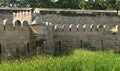 Strong stone wall and fort battlements with trench landscape Royalty Free Stock Photo