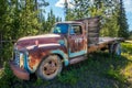 Fort Fraser, British Columbia, Canada. Old rusted car in the forest