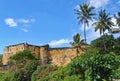 Fort Jesus, Mombasa, Kenya on sunny with blue sky and green plants and palm trees