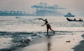 Fort Kochi fisherman throwing his net into Royalty Free Stock Photo