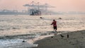 Fort Kochi fisherman throwing his net into the water india Royalty Free Stock Photo