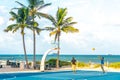 FORT LAUDERDALE, FLORIDA - September 20, 2019: men exercising in the public exercise equipment area and basketball