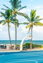 FORT LAUDERDALE, FLORIDA - September 20, 2019: men exercising in the public exercise equipment area and basketball