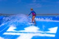 FORT LAUDERDALE, USA - APRIL 30, 2018: Man surfing on the FlowRider aboard the Oasis of the Seas by Royal Caribbean Royalty Free Stock Photo