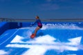 FORT LAUDERDALE, USA - APRIL 29, 2018: Man surfing on the FlowRider aboard the Oasis of the Seas by Royal Caribbean