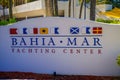 FORT LAUDERDALE, USA - JULY 11, 2017: Informative sign of yatching center located in a white stoned wall in the city of