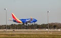 FORT MYERS, FLORIDA, USA - 27 FEB 2024. Southwest Airlines N406WN Boeing 737-7H4 landing at Southwest Florida International Royalty Free Stock Photo