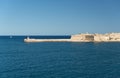 Fort Ricasoli and a lighthouse in Malta Royalty Free Stock Photo