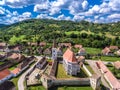 The fortified church Cloasterf. Traditional saxon village in Transylvania, Romania. Aerial view from a drone. HDR image. Royalty Free Stock Photo
