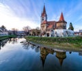 Fortified church of Cristian from Sibiu Hermannstadt. Transylvania, Romania, Medieval Church reflection in water. Medieval Archite Royalty Free Stock Photo