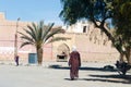 Fortified city of Erfoud along the former caravan route between the Sahara and Marrakech in Morocco with snow covered Atlas