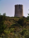 Fortified cylindrical stone watchtower.