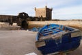 The fortress of Castelo Real of Mogador and blue fishing boata a