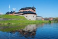 The fortress of the city of Hameenlina on the bank of the Vanayavesi lake in the sunny June afternoon. Finland