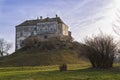 Fortress on a green hill. Olesko castle . Western Ukraine Royalty Free Stock Photo