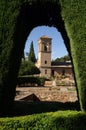 View through the green arch to the tower in the fortress of Granada