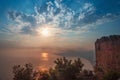 Fortress wall on mountain view of sunset on sea Royalty Free Stock Photo