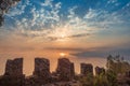 Fortress wall on mountain view of sunset on sea Royalty Free Stock Photo