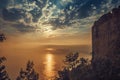 Fortress wall on mountain view of sunset on sea Royalty Free Stock Photo