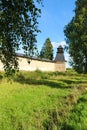 Fortress wall and tower of Pskov-Pechory Dormition Monastery in Pechory, Pskov region, Russia under blue sky Royalty Free Stock Photo