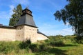 Fortress wall and tower of Pskov-Pechory Dormition Monastery in Pechory, Pskov region, Russia under blue sky Royalty Free Stock Photo