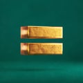 Fortuna Gold Equal on Tidewater Green background Royalty Free Stock Photo