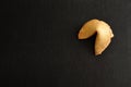 Fortune cookie on a black background Royalty Free Stock Photo