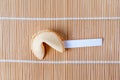 Fortune Cookie With Blank Slip on Bamboo Mat Royalty Free Stock Photo
