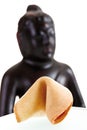 Fortune cookie and buddha head, close-up Royalty Free Stock Photo