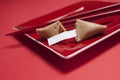 Fortune Cookie and Chopsticks in Square Red Plate Royalty Free Stock Photo