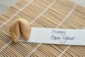 A fortune cookie and a note Happy New year Royalty Free Stock Photo