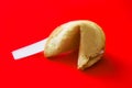 Fortune cookie on red background Royalty Free Stock Photo