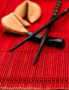 Fortune cookies and black chopsticks. Chinese new year concept Royalty Free Stock Photo