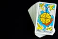 Fortune Tarot card on black background. Ancient symbols are used for divination