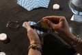 Fortune teller with deck of tarot cards at grey table, closeup Royalty Free Stock Photo