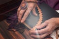 Fortune teller is holding a book on white or black magic. The concept of predicting the future, magic, occultism.