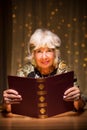 Fortune teller with magic spellbook Royalty Free Stock Photo