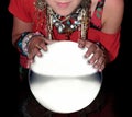 Fortune teller over a blank crystal ball