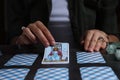 Fortune teller predicting future on spread of tarot cards at grey table, closeup Royalty Free Stock Photo