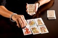 Fortune teller reading a deck of Tarot Cards Royalty Free Stock Photo