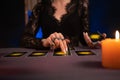 A fortune teller reading Tarot cards. Hands close up. divination, astrology and esotericism Royalty Free Stock Photo