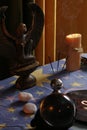 Fortune teller`s table with crystal ball, incense, candles and other occult objects Royalty Free Stock Photo