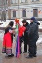 Fortune teller speaks to a couple. Shrovetide celebration in Moscow