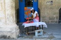 A fortune teller in the street of Havana with a suspicious look