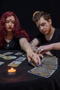 Fortune teller using tarot cards on black background Royalty Free Stock Photo