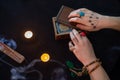 Fortune teller using tarot cards on black background Royalty Free Stock Photo
