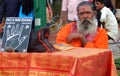 Fortune teller wait to read face and hand and forecast the future in a public park