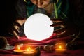 Fortune teller woman looking at crystal ball Royalty Free Stock Photo