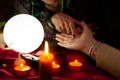 Fortune teller woman point her finger to another woman palm Royalty Free Stock Photo